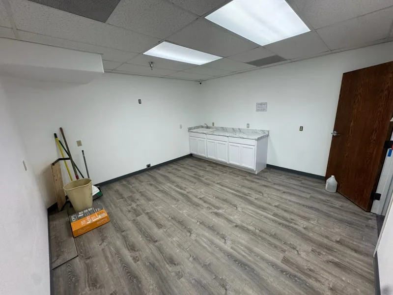 Finished room with new flooring and sink cabinet - Extreme Maintenance, Bullhead City AZ