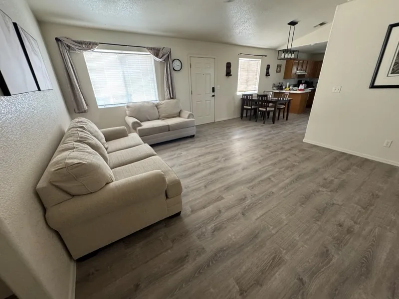 Finished living room with new plank flooring - Extreme Maintenance, Bullhead City AZ