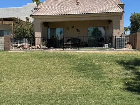 Backyard wall and iron fence - Extreme Maintenance, Bullhead City AZ
